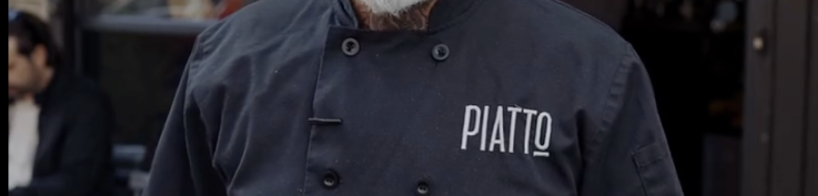 PHOTO OF MAN WEARING EMBROIDERED CHEF JACKET